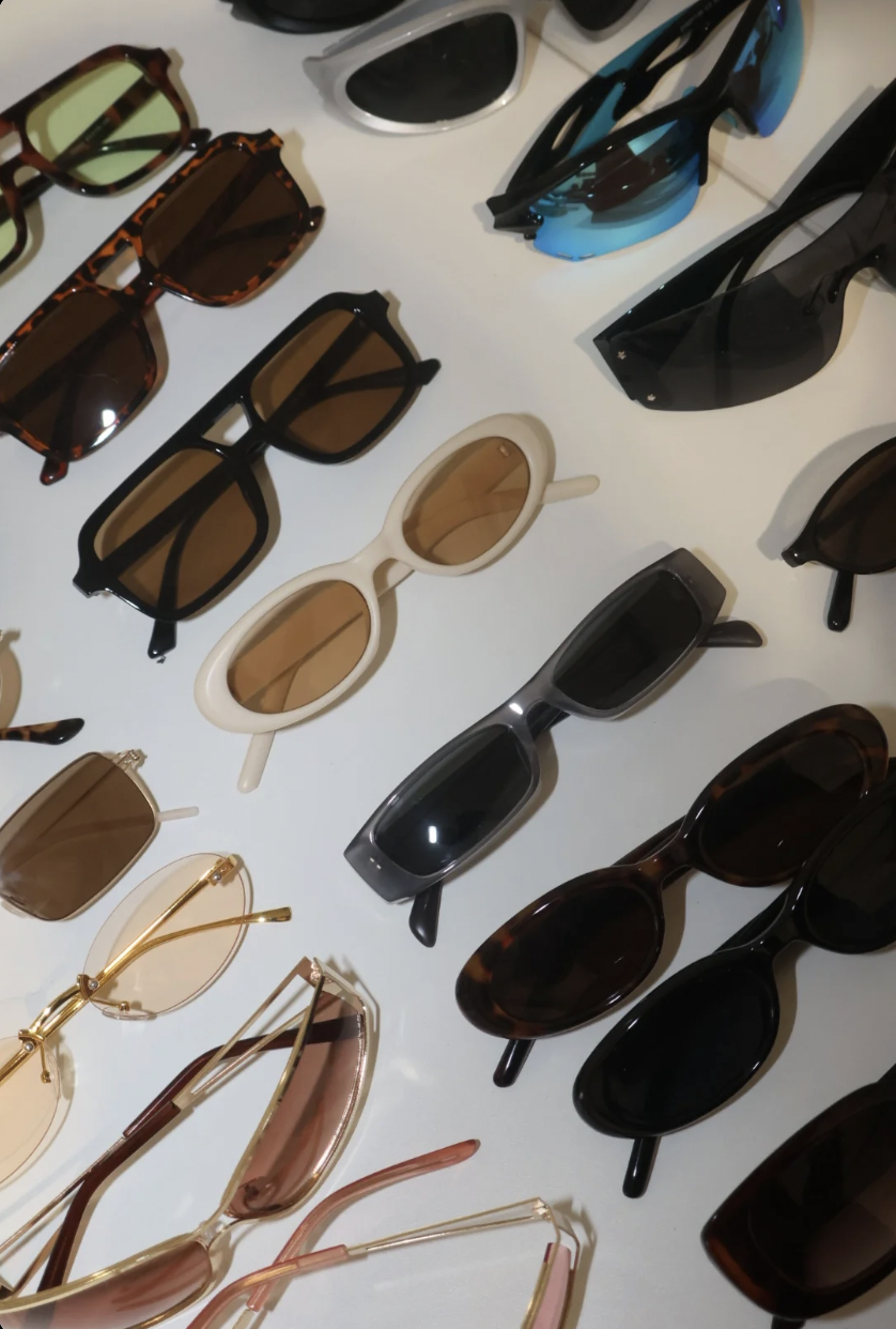 A collection of sunglasses arranged in a grid